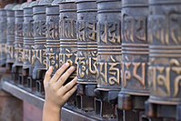 A little boy rolling the prayer wheels at Swayambhunath, Nepal Prayer Wheels.jpg