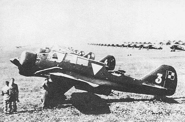 PZL.23A Karaś at the Warsaw Airport. Note lines of PZL P.11 or PZL P.7 fighters in the background