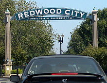 The western arch with the city slogan below Redwood City western sign.jpg