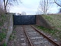 Coupure in de Zwaaksedijk, gemaakt ten behoeve van de aanleg van de spoorbaan van de tramlijn. Bouwjaar 1927.