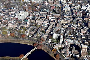 a built up area seen from the air with a river in the foreground