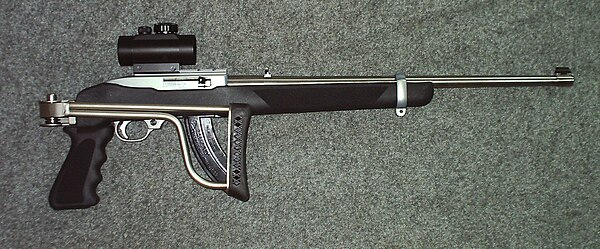 Ruger 10/22 "Stainless" With an aftermarket Butler Creek Folding Stock and a TRUGLO Red Dot Sight