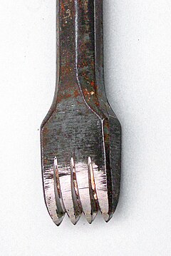 A toothed stone chisel, used by stone sculptors and stonemasons