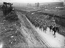 Column of the 2nd Battalion, Gordon Highlanders marching to the trenches along the Becordel-Fricourt road, France, October 1916. The Battle of the Somme, July-november 1916 Q1393.jpg