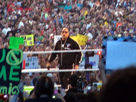 The Rock in the ring as host of WrestleMania XXVII in April 2011