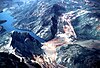 A destabilized mountain sliding and creating a dam and lake