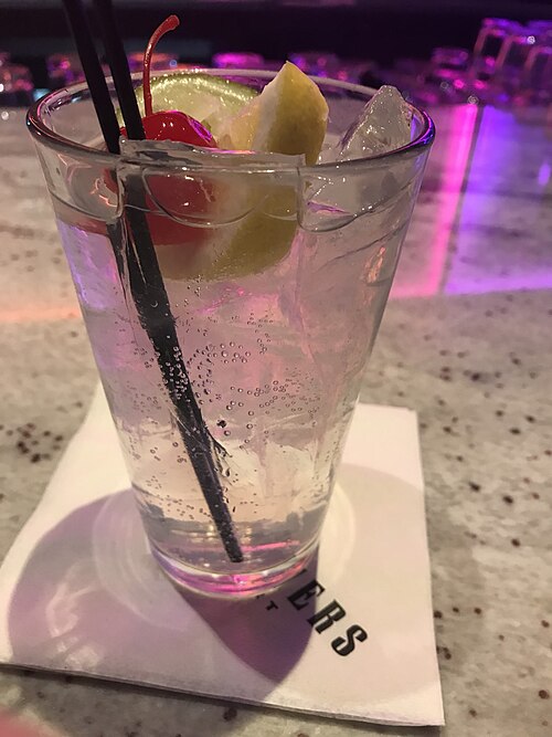 A Tom Collins, serviced in a glass of the same name.