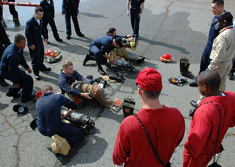 File:US Navy 090508-N-5292M-082 Sailors assigned to the amphibious assault ship USS Kearsarge (LHD 3) compete in a race to don their firefighting ensembles during the Damage Control Marathon at the Farrier Fire Fighting compound dur.jpg