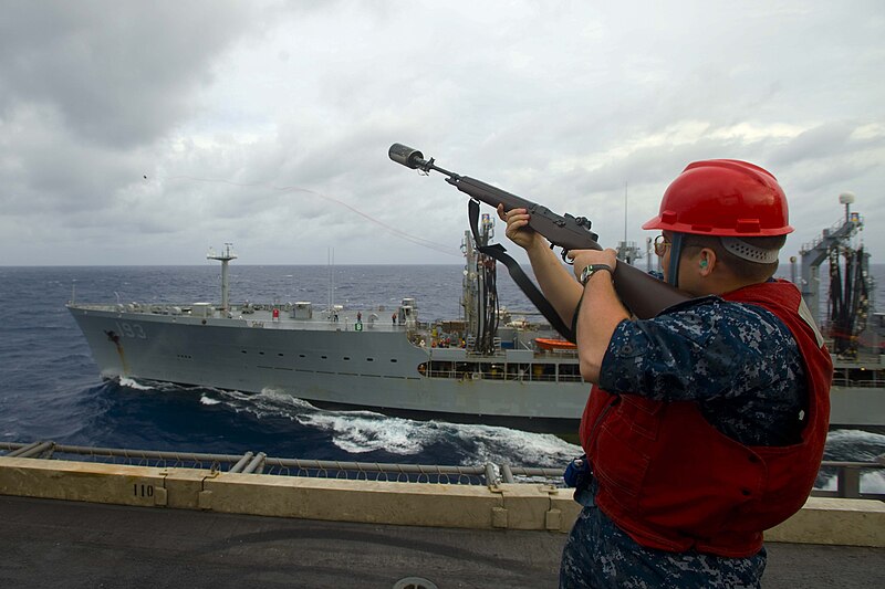 File:US Navy 100809-N-6720T-013 Gunner's Mate 2nd Class Paul Engoe, from Flint, Mich., uses an M-14 service rifle to fire a phone and distance line from the aircraft carrier USS George Washington (CVN 73) across the bow.jpg