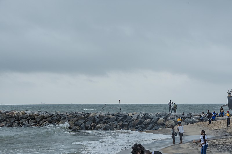 File:Waves-against-a-wave-breaker-at-the-beach-elegushi.jpg