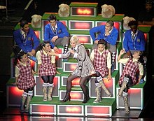 The stage was designed like a hill with sheep for performances on The Sweet Escape Tour, as a reference to a scene from The Sound of Music WindItUp4.jpg