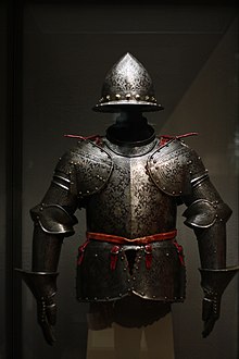 An etched and partially russeted and gilded half armor made of steel, brass, leather, and textiles 1600 Milan Half Armor.jpg
