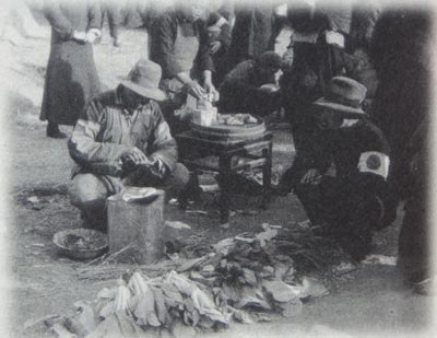 Nanking residents with armbands of the Japanese flag