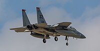 A US Air Force F-15C Eagle, tail number 83-0011, on final approach at Kadena Air Base in Okinawa, Japan. The aircraft is assigned to the 67th Fighter Squadron.