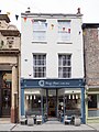 23, Fossgate. House with shop. Early C19. Grade II listed.