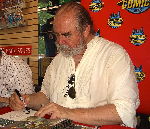 Kaluta sketching Howard the Duck on a copy of Fear Itself: Fearsome Four, at a June 8, 2011 Midtown Comics appearance