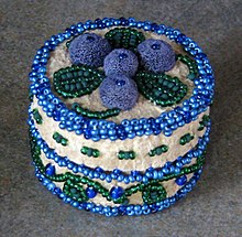 Moose hair tufting on an Athabaskan beaded hide box, Fairbanks, Alaska Ak moosehair tufting.jpg