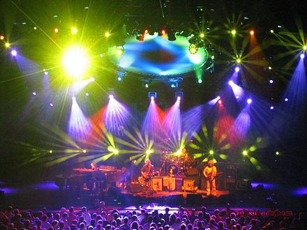 Phish in concert at the Alpine Valley Music Theatre in East Troy, Wisconsin, in July 2003, accompanied by a light show created by Chris Kuroda