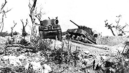 Two US M4 Sherman tanks knocked out by Japanese artillery at Bloody Ridge, Lejima island during the Battle for Okinawa on April 20, 1945