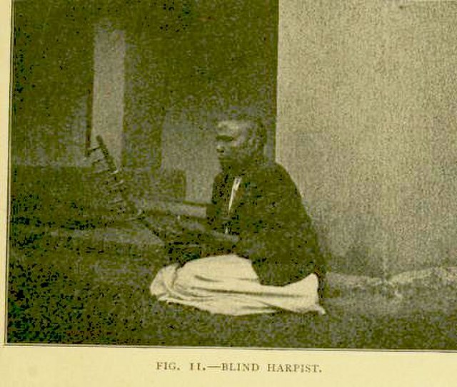 A blind Buganda harpist c. 1911