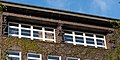 Deutsch: Ida-Ehre-Schule in Hamburg-Harvestehude: Kyriatiden von Richard Kuöhl an der Fenstergruppe des Musiksaals. This is a photograph of an architectural monument. It is on the list of cultural monuments of Hamburg, no. 19907