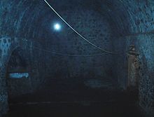 Inside the dungeon of Cape Coast Castle, where hundreds of enslaved people were held in cramped conditions before being transferred to boats bound for the western hemisphere Cape Coast dungeon.JPG