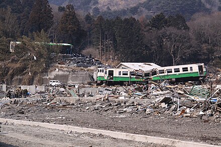 Train washed off tracks by a tsunami at Onagawa. Carried train in Ishinomaki Line.JPG