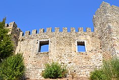 From outside the walls, two of the rectangular windows common to the late history of the castle Castelo de Pombal 14.jpg