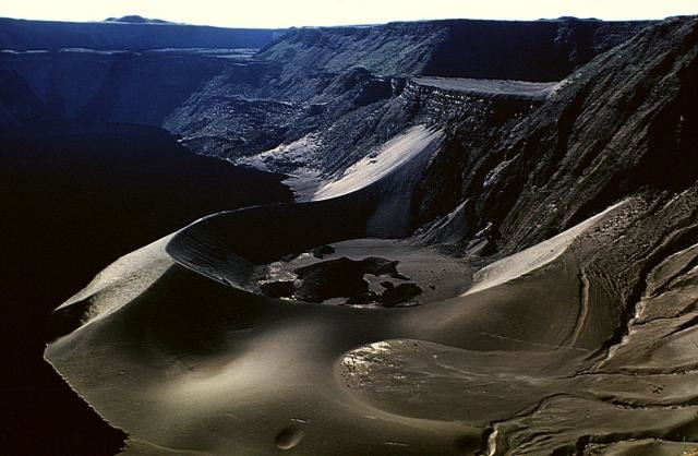 A large tuff cone occupying the east-northeast side of summit caldera