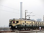 Green-and-tan electric train