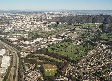 Aerial view of Colma, city of cemeteries, from the south