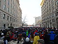 A crowd of people walking south toward the Orange Gate to get into the US Capitol area during the 2013 US Presidential Inauguration. Taken on First St. NW between D St. NW and C St. NW.