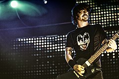 Dave Grohl of Foo Fighters performing in 2005. Foo Fighters are widely regarded as one of the most culturally significant rock bands of the 2000s. The decade saw Foo Fighters win the Grammy Award for Best Rock Album a record-breaking three times; in 2001, 2004, and 2008. Dave Grohl (132997591).jpeg