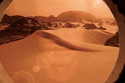 Artistic simulated photo looking out a portal spacecraft coming for a Mars landing.