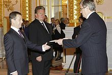 Trouveroy presenting his credentials to Dmitry Medvedev in October 2009. Dmitry Medvedev with Guy Trouveroy.jpg
