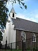 Kerk van Durgerdam. Zaalvormig kerkgebouw met door lisenen gelede zijmuren en een dakruiter, waterstaatskerk