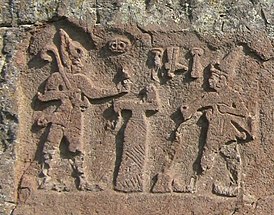 Хаттусили III (справа) перед богом погоды. Фирактинский рельеф[en].