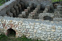 Foundations of a house in Flavia Solva showing the hypocaust heating system Flavia Solva hypocaust.jpg