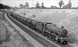 Afternoon of 22 August 1959: GWR Hall Class 4-6-0 No. 4941 Llangedwyn Hall hauls an empty train of 13 milk tank wagons and one Siphon G past Frome, Somerset on the Reading to Taunton line, on the return run from Express Dairies Kensington Olympia to Plymouth, Devon Frome 1 clink road geograph-2468446-by-Ben-Brooksbank.jpg