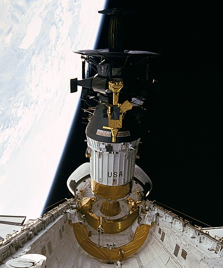 Galileo is prepared for release from Space Shuttle Atlantis. The Inertial Upper Stage (white) is attached.