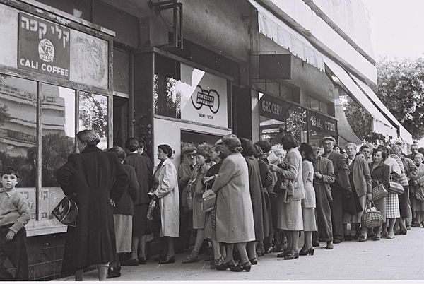 Residents of Tel Aviv standing in line to buy food rations during the austerity period, 1954
