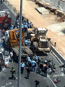 Jerusalem, July 2, 2008. A Palestinian man drives a front-end loader into several vehicles in Jerusalem, killing three before being shot dead. Jerusalem tractor run over terror attack2 02-07-08.jpg