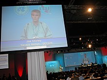 John Shirley, at that time, President of the Navajo Nation, at the WSIS - Tunis, 2005, where he announced the birth of the Navajo Nation Portal. John Shirley, presidente Navajo Nation, al WSIS di Tunisi, 2005. Annuncio della nascita del Navajo Nation Portal.jpg