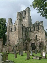 South face of the surviving West tower of Kelso Abbey (viewed from the south east). Kelso Abbey 2.jpg