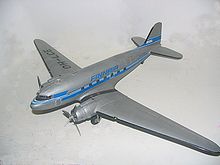 Scale model of a Douglas DC-3 in Finnair Airlines colors. Many airlines use model aircraft as advertisement items Koottava DC3.JPG