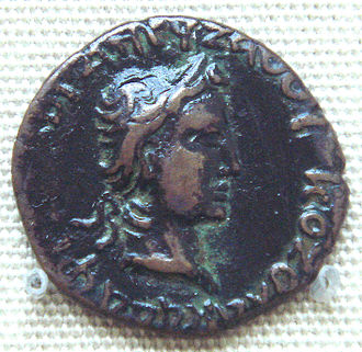 Coin of Kushan ruler Kujula Kadphises, in the style of Roman emperor Augustus. British Museum. AE dichalkon, Chach, c. first half of 1st. Century, Weight:3.26 gm., Diam:18 mm. Caption: obverse in Greek KOZOLA KADAPhES KhORANOU ZAOOU, reverse in Kharoshti. KujulaKadphisesCoinAugustusImitation.jpg