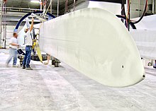 Wind turbine under construction, Grand Forks LMGlasfiberBlade (cropped).jpg