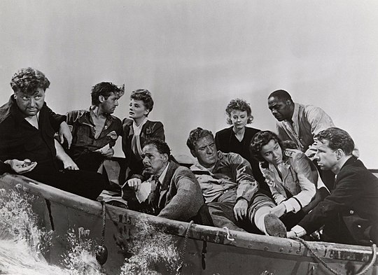 L-R: Walter Slezak, John Hodiak, Tallulah Bankhead, Henry Hull, William Bendix, Heather Angel, Mary Anderson, Canada Lee, and Hume Cronyn in Alfred Hitchcock's Lifeboat (1944)