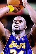 Shaquille O'Neal is taking a free throw while playig for the Phoenix Suns.