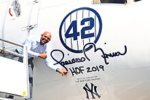 Rivera with a Boeing 757 dedicated to him by Delta Air Lines at John F. Kennedy International Airport in 2019 Mariano Rivera Delta gate dedication (48322988681).jpg